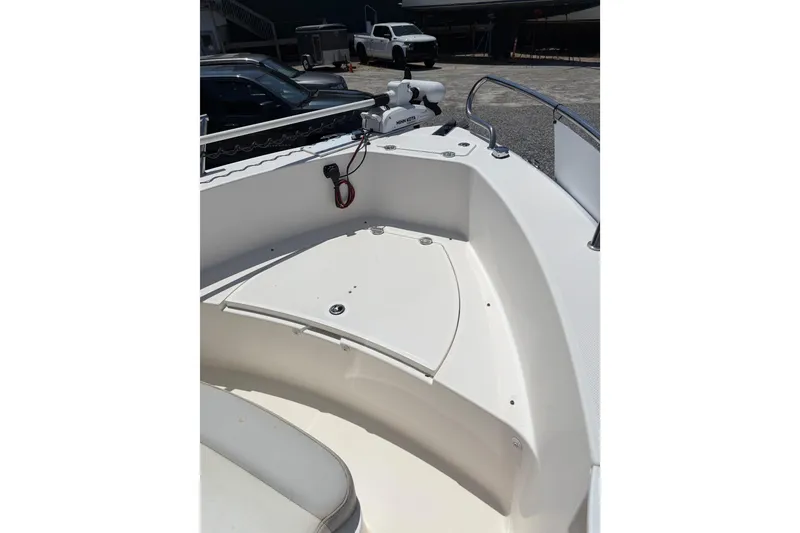 Slide: The Image of 2013 Everglades 210 Center Console boat interior, featuring a clean, spacious deck area. - 15