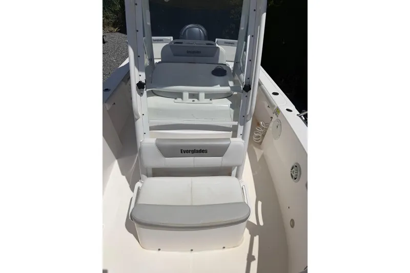 Slide: The Image of 2013 Everglades 210 Center Console boat interior with seating and console view. - 10