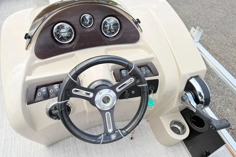 Slide: The Image of Steering console of 2019 South Bay 520CR boat with gauges and controls. - 11