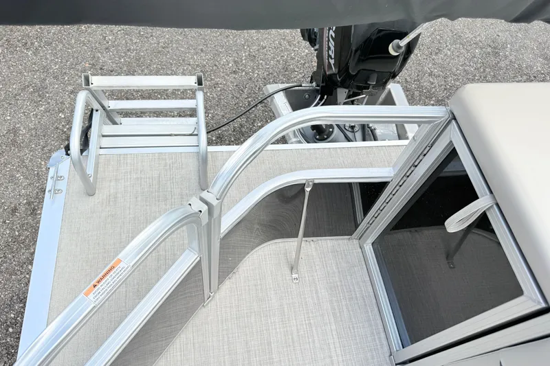 Slide: The Image of 2019 South Bay 520CR pontoon boat with aluminum railing and motor, viewed from above. - 13