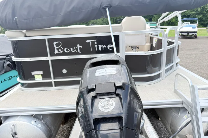 Slide: The Image of 2019 South Bay 520CR pontoon boat with "Bout Time" name and 25 HP motor. - 3