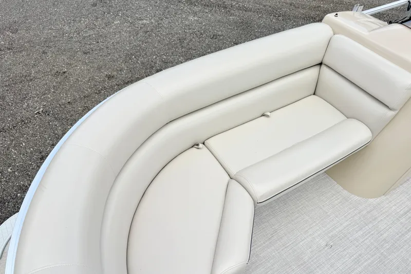 Slide: The Image of 2019 South Bay 520CR boat with beige cushioned seating on deck. - 6