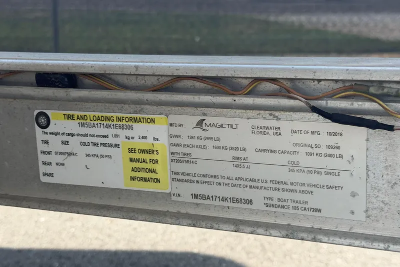 Slide: The Image of Tire and loading information label on a 2019 Sea Born SV19 Bay boat trailer. - 59
