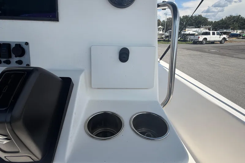 Slide: The Image of 2019 Sea Born SV19 Bay boat console with cup holders and control panel. - 19