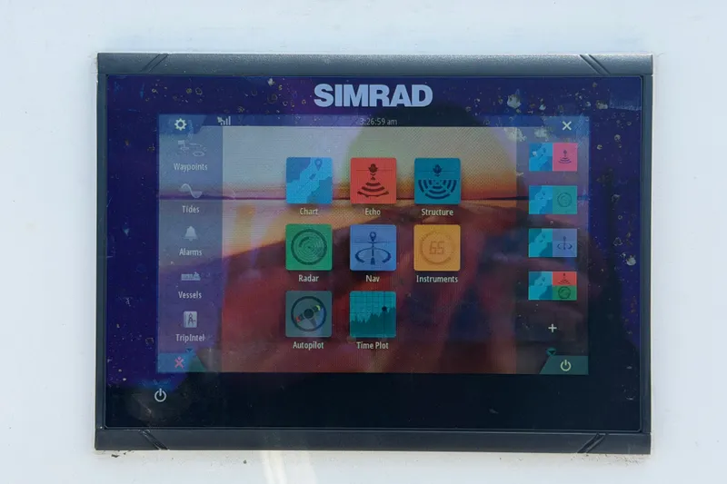 Slide: The Image of Simrad navigation display on 2019 Sea Born SV19 Bay boat, showing various marine functions. - 17