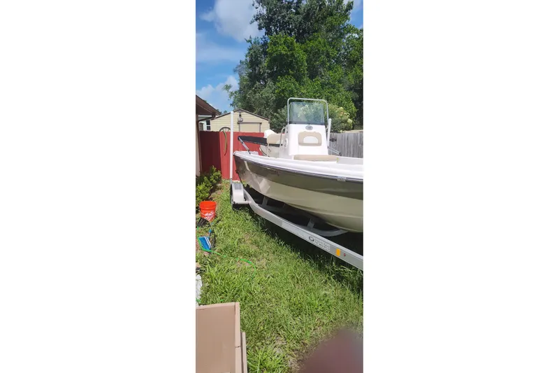Slide: The Image of 2019 Sea Born SV19 Bay boat on trailer in grassy yard. - 1