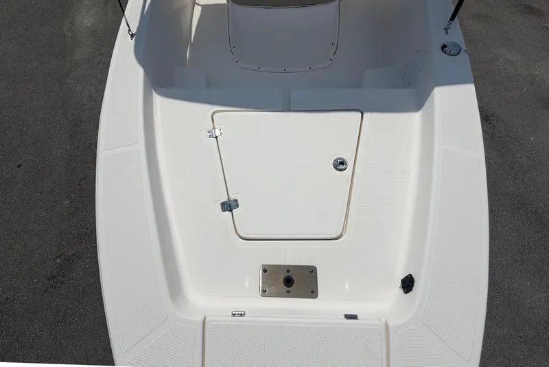 Slide: The Image of The image shows the deck of a 2019 Sea Born SV19 Bay boat with a storage hatch. - 35