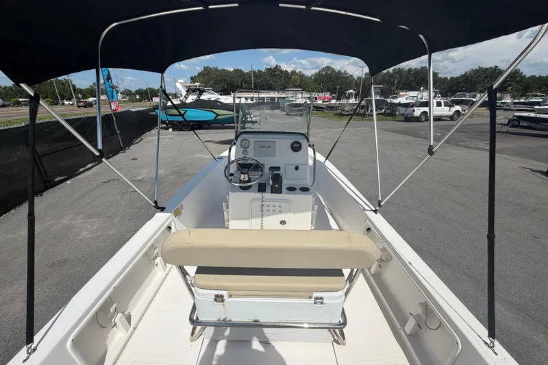 Slide: The Image of 2019 Sea Born SV19 Bay boat with canopy, parked in a marina lot. - 10