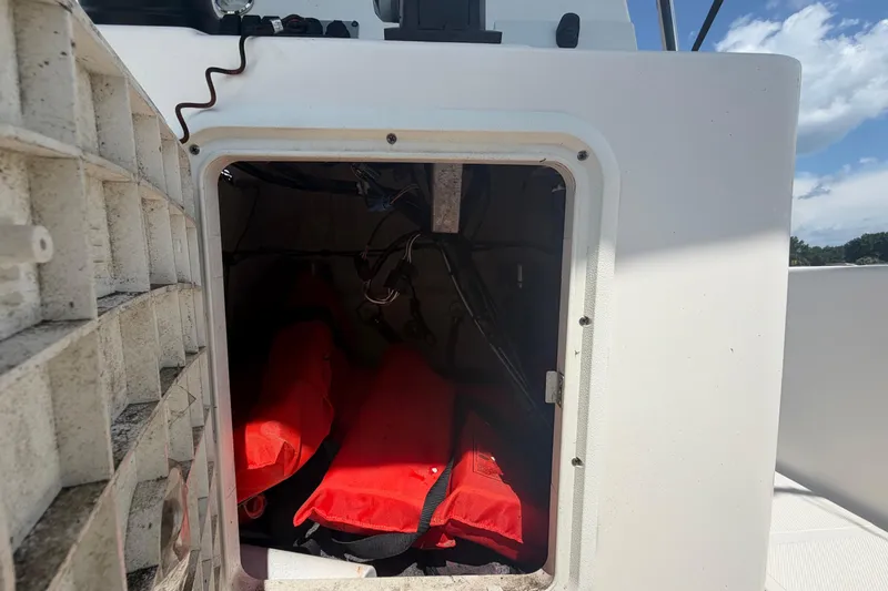 Slide: The Image of 2019 Sea Born SV19 Bay boat storage compartment with life jackets inside. - 14