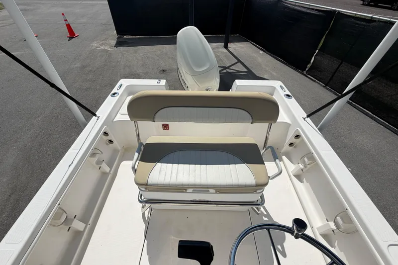 Slide: The Image of 2019 Sea Born SV19 Bay boat interior with seating and steering wheel. - 45
