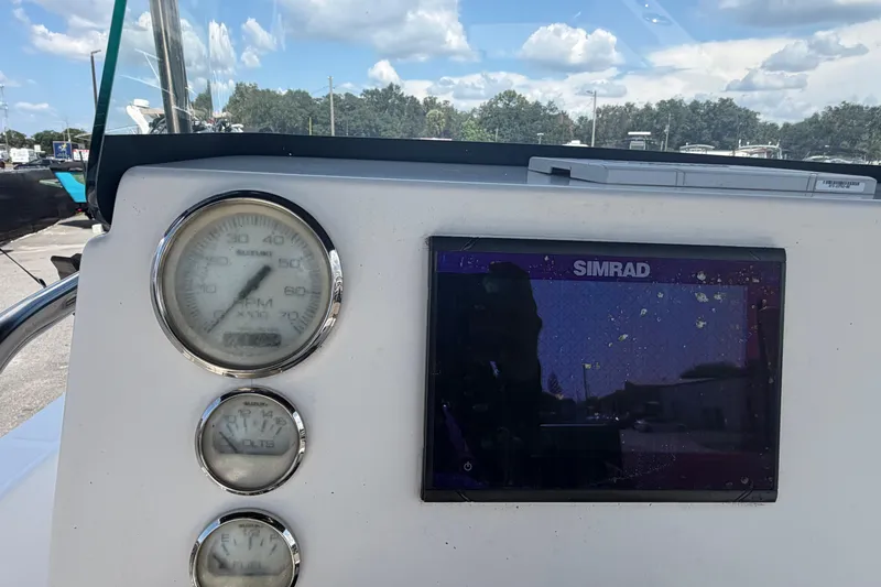 Slide: The Image of Dashboard of a 2019 Sea Born SV19 Bay boat with Simrad display and gauges. - 16