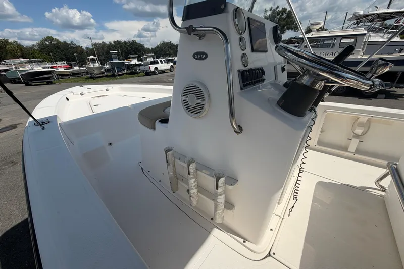 Slide: The Image of 2019 Sea Born SV19 Bay boat interior with steering console and seating. - 23