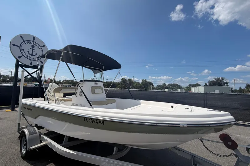 The Image of 2019 Sea Born SV19 Bay boat on trailer under clear blue sky. - 0