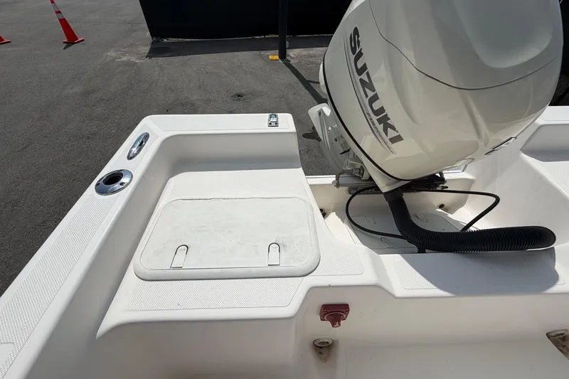 Slide: The Image of 2019 Sea Born SV19 Bay boat with Suzuki outboard motor, docked on pavement. - 49