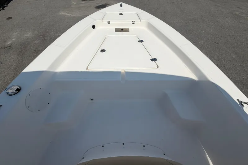 Slide: The Image of 2019 Sea Born SV19 Bay boat deck, featuring storage compartments and seating area. - 25