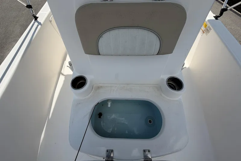 Slide: The Image of The image shows the interior of a 2019 Sea Born SV19 Bay boat with a built-in livewell. - 38
