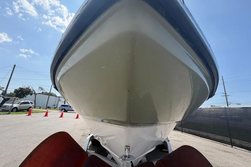 Slide: The Image of 2019 Sea Born SV19 Bay boat, close-up view from below, parked outdoors. - 8