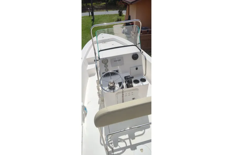 Slide: The Image of 2019 Sea Born SV19 Bay boat cockpit with steering wheel and control panel. - 4