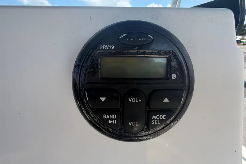 Slide: The Image of Close-up of a 2019 Sea Born SV19 Bay boat control panel with buttons and display. - 18
