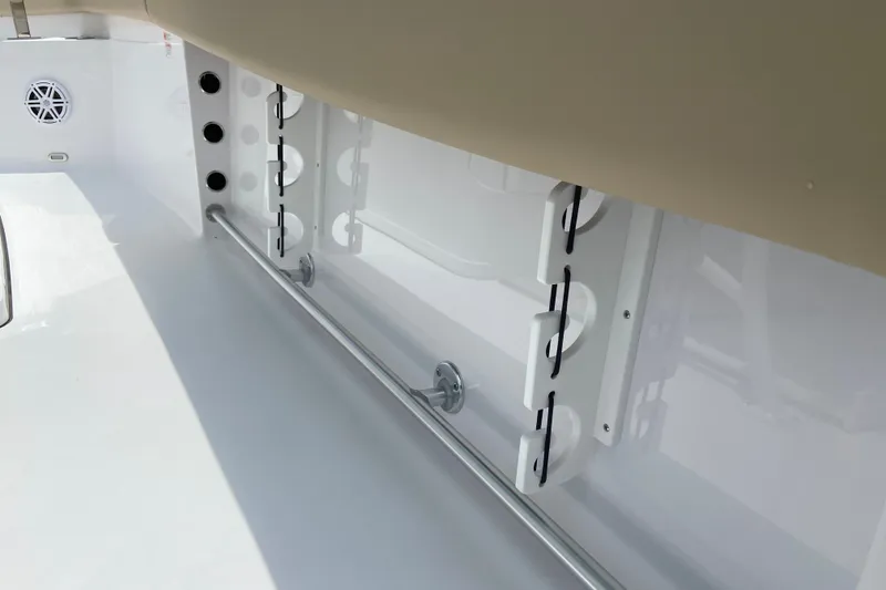 Slide: The Image of Interior view of 2027 Sportsman Heritage 231 Center Console boat, featuring rod holders and sleek design. - 12