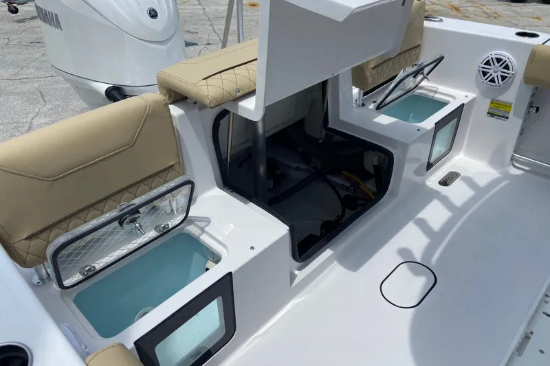 Slide: The Image of 2027 Sportsman Heritage 231 Center Console boat interior with seating and storage compartments. - 5