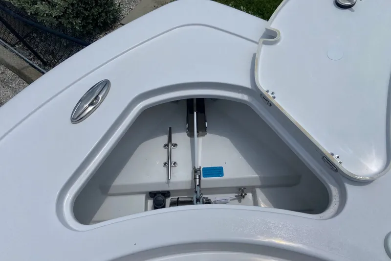 Slide: The Image of Open anchor compartment on 2027 Sportsman Heritage 231 Center Console boat. - 27
