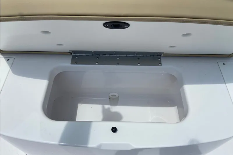 Slide: The Image of 2027 Sportsman Heritage 231 Center Console storage compartment with open lid. - 32