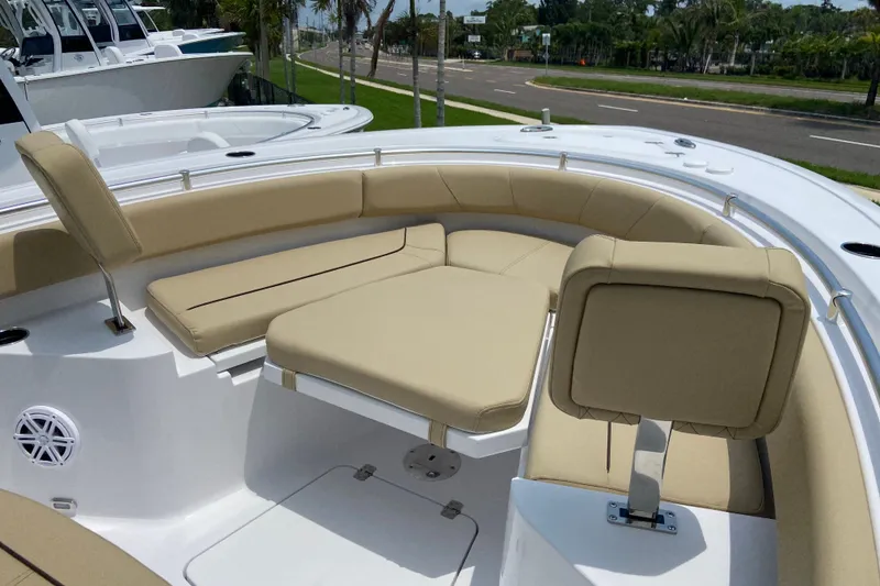 Slide: The Image of 2027 Sportsman Heritage 231 Center Console boat with beige seating and modern design. - 29