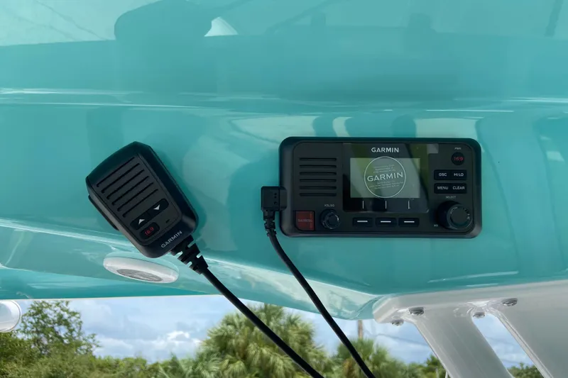 Slide: The Image of Garmin marine radio on 2027 Sportsman Heritage 231 Center Console boat dashboard. - 19