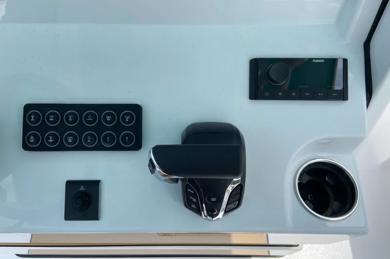 Slide: The Image of 2027 Sportsman Heritage 231 Center Console dashboard with controls and cup holder. - 17