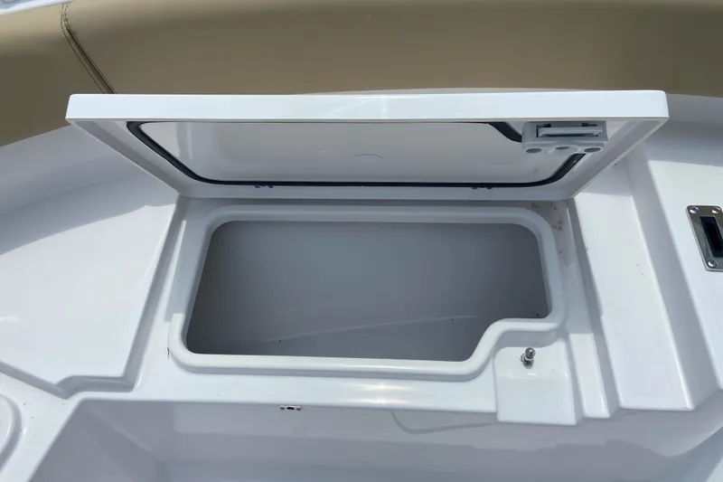 Slide: The Image of Open storage compartment on 2027 Sportsman Heritage 231 Center Console boat. - 26