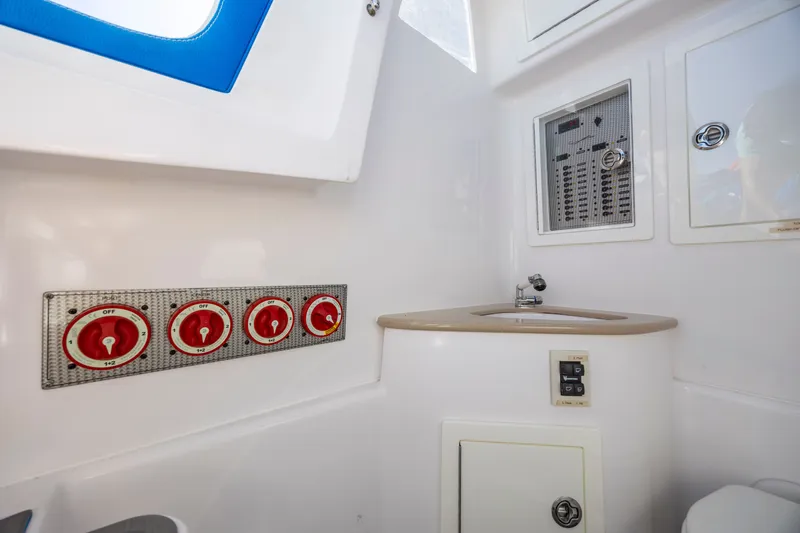 Slide: The Image of Interior of 2022 Blackwater 36 Sport boat with control panel and sink. - 22
