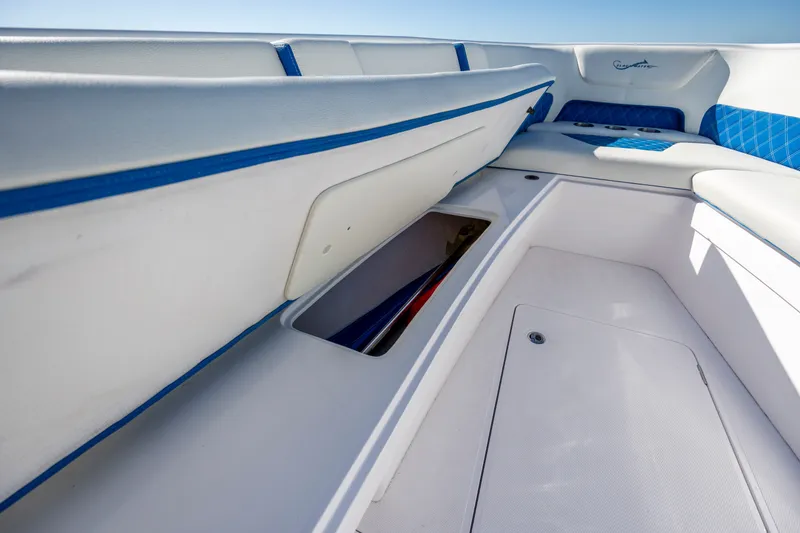 Slide: The Image of 2022 Blackwater 36 Sport boat interior with open storage compartment and blue accents. - 25