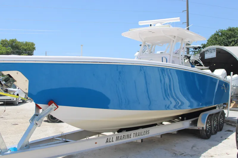 Slide: The Image of 2022 Blackwater 36 Sport boat on trailer, featuring sleek blue hull design. - 3