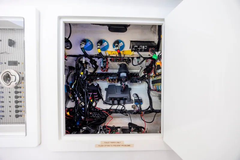 Slide: The Image of Electrical panel inside a 2022 Blackwater 36 Sport boat, showcasing wiring and components. - 29