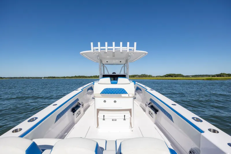 Slide: The Image of 2022 Blackwater 36 Sport boat on calm water under clear blue sky. - 8