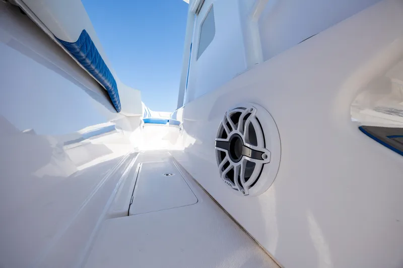 Slide: The Image of Interior view of 2022 Blackwater 36 Sport boat with speaker and blue accents. - 15