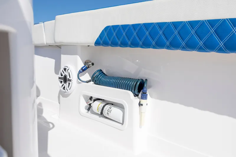 Slide: The Image of Interior detail of 2022 Blackwater 36 Sport boat with blue upholstery and coiled hose. - 11