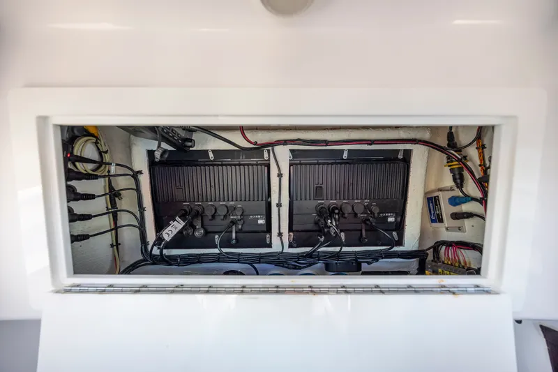 Slide: The Image of Electrical panel inside 2022 Blackwater 36 Sport boat, showcasing wiring and components. - 30