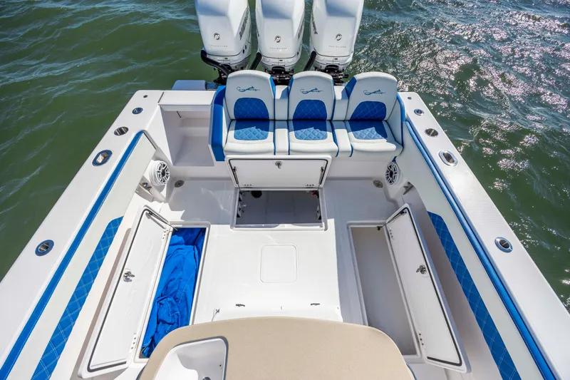 Slide: The Image of 2022 Blackwater 36 Sport boat deck with seating and storage compartments. - 34