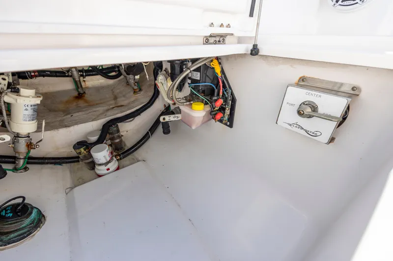 Slide: The Image of Engine compartment of 2022 Blackwater 36 Sport boat, showing wiring and control panel. - 42