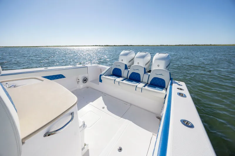 Slide: The Image of 2022 Blackwater 36 Sport boat with triple engines on open water. - 4