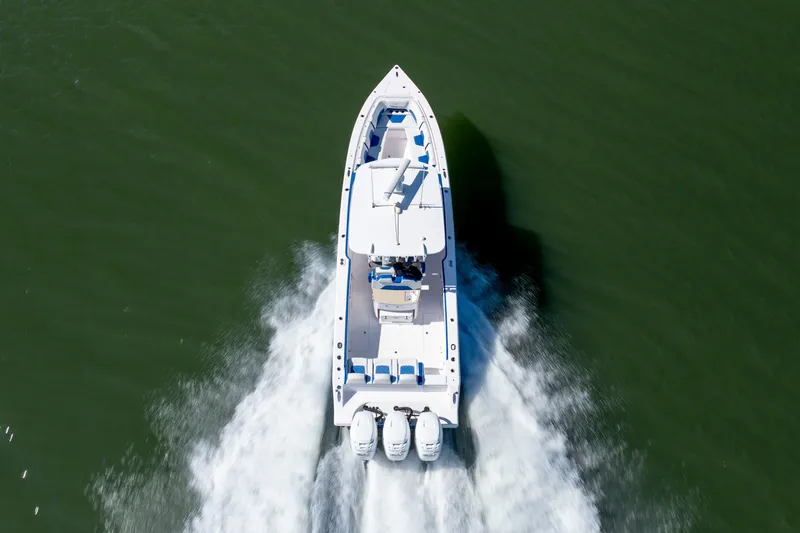 Slide: The Image of Aerial view of 2022 Blackwater 36 Sport boat speeding on water. - 55