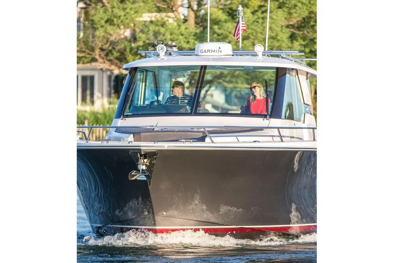 Slide: The Image of Manufacturer Provided Image: 2018 Tiara Yachts Q44 cruising on water with two people onboard. - 3