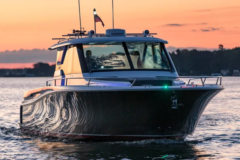 The Image of Manufacturer Provided Image: 2018 Tiara Yachts Q44 cruising at sunset on calm waters. - 0
