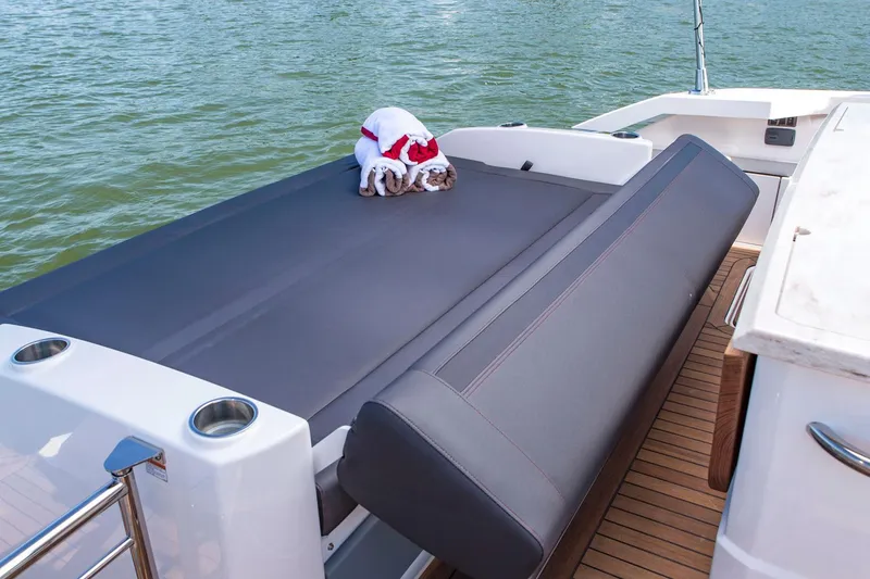 Slide: The Image of Manufacturer Provided Image: 2018 Tiara Yachts Q44 deck with a dog in a Santa outfit. - 6