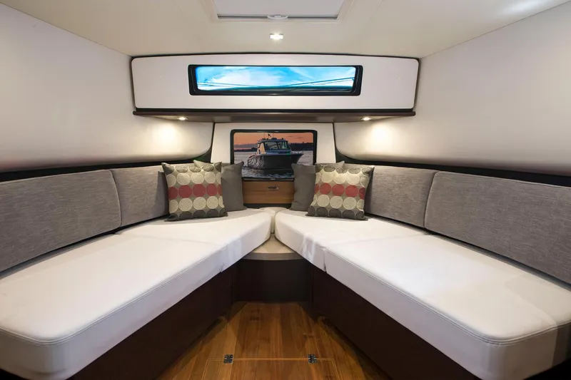 Slide: The Image of Manufacturer Provided Image: Interior cabin of 2018 Tiara Yachts Q44 with modern seating and window view. - 11