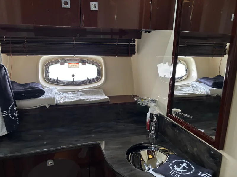 Slide: The Image of The image shows an elegant bathroom with a sink, mirror, and a small window. - 22