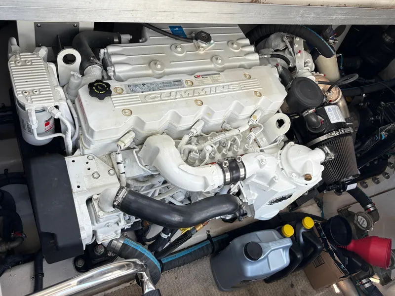 Slide: The Image of A Cummins engine in a 2012 Sea Ray 470 Sundancer, surrounded by various maintenance tools. - 29