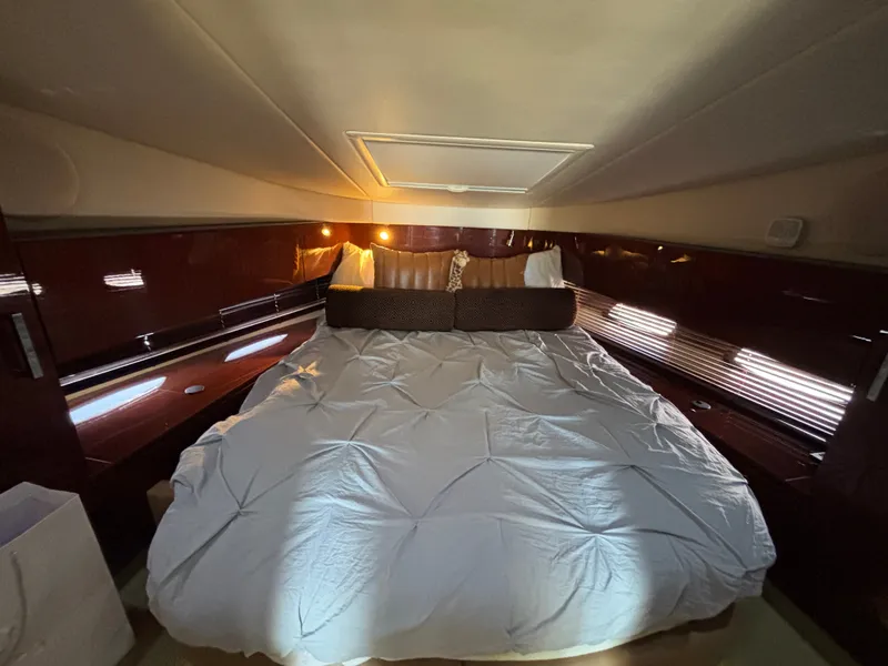 Slide: The Image of The image shows a cozy cabin with a large bed and soft lighting. - 19